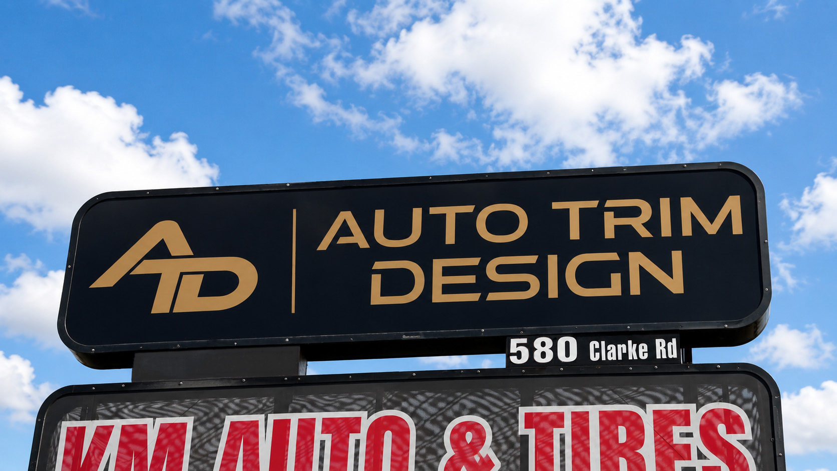 Auto Trim Design road sign at 580 Clarke Rd